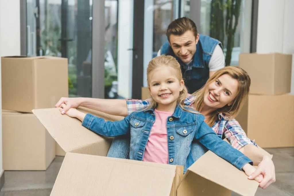 A happy family unboxing their belongings and settling into their new home in Edmonton