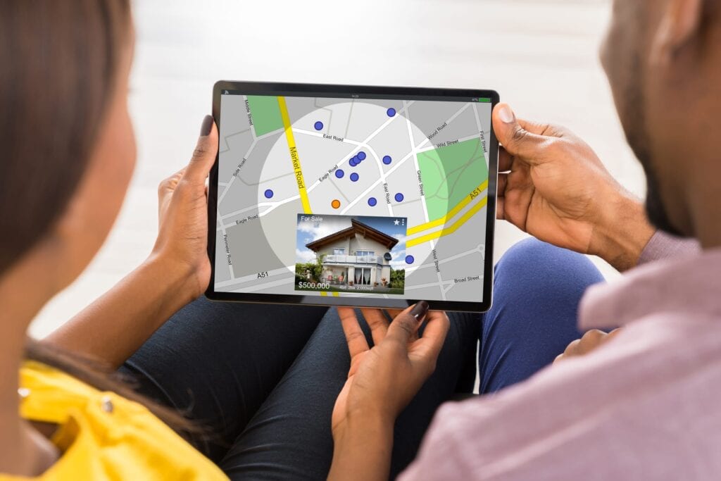 Couple checking out the factors to consider when choosing the best Edmonton neighbourhoods.